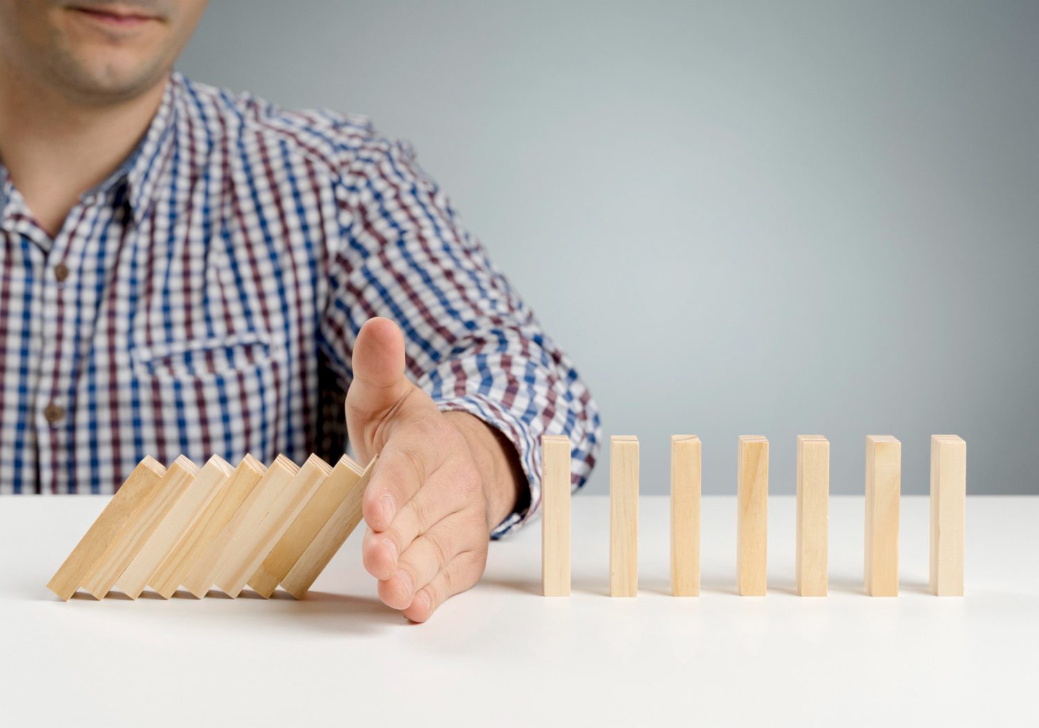 domino wooden blocks paused from falling